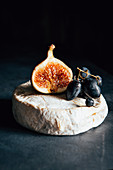 Camembert cheese with grapes and fig