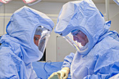 Surgeons wearing surgical hoods