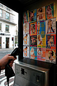 Sex worker cards in public phone box