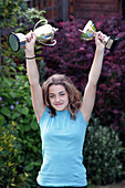 Girl with sports trophies