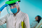 Exhausted medical worker in PPE