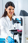 Researcher studying cell culture