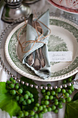 Festive, autumnal place setting decorated with young grapes