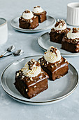 Chocolate individual mini cakes with cream cheese and nuts