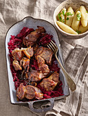 Pork neck with red cabbage and apples