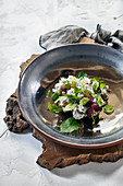 Spring potato salad with wild herbs and leaves