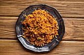 Indian pilaf with biryani rice on wooden rustic background