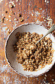 Oat crumble mixture in a bowl