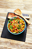 Chickpea salad with peppers, cucumber and parsley