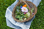 Different edible flowers in a basket