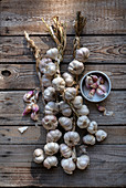 Garlic braids on a wooden garden counter