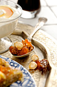 Dried fruits on silver spoons