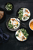 Turkish eggs with broad beans sprinkled with dill and black cumin