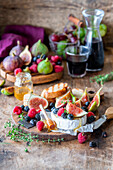 Brie with honey, figs, and berries