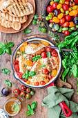 Roast chicken with colorful tomatoes