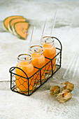 Honey melon and physalis juice in jar