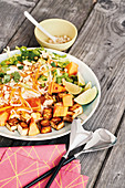 Vegetarian papaya salad with rice noodles and tofu