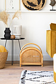 Rattan magazine rack in living room with yellow accents