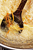 Reducing orange jam with zest
