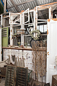 An old window and flea market items in a barn