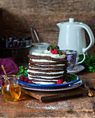 Chocolate pancakes with sour cream and berries