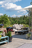 An outdoor lounge on a wooden terrace