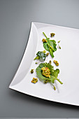 Overgrown white cabbage with pistachio cream and buckwheat