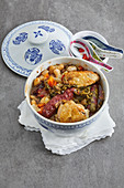 Chinese cassoulet with chicken, cherry and merguez sausages