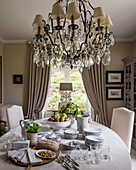 Elaborate chandelier and ornate table lamp