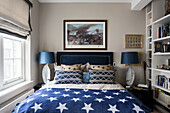 Nickel leaf table lamps with star bedspread and military artwork