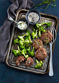 Baked burgers with broccoli