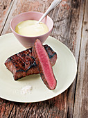A Wagyu beef flat iron steak made in a Beefer with sauce Hollandaise
