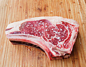 A raw steak with coarse seasalt