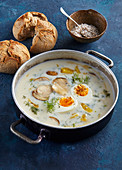 Sour mushroom soup with potatoes and boiled egg
