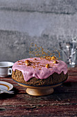 Beetroot sponge cake with beetroot and cream cheese frosting and caramelised macadamia nuts