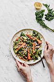 Salad with millet kale roasted carrots avocado beans and chickpeas