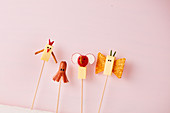 Animal finger food made with cheese, Frankfurters and radishes