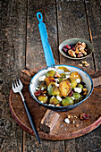 Fried Brussels sprouts with feta, walnuts and cranberries