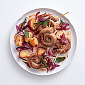 Grilled salsiccia snails with red onions and peach