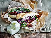 Sticky pork rolls with red slaw