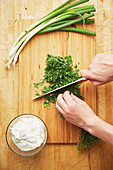 Herbs being chopped for herb quark