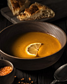 Lentil soup puree in a wooden plate