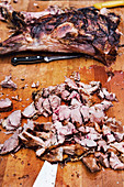 Asado grilled lamb, whole and pulled
