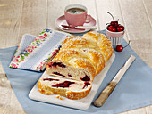 A yeast dough plait with a cherry filling