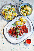 Korean chilli, sesame and honey chicken, Corn cobs with lime, chilli and feta butter