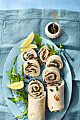 Burritos with squid, capers and cold roast meat