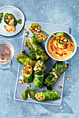 Stuffed cabbage roulade with a coconut and peanut dip
