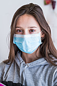 Teenage girl wearing face mask
