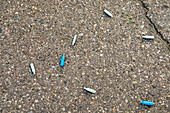 Discarded laughing gas capsules