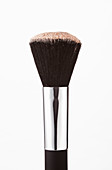 Close up of blush powder on makeup brush